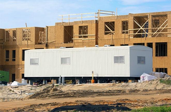 crane lifting modular building for construction office rentals in Clarendon Hills, IL